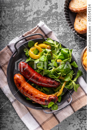 Grilled spicy sausages Grilled spicy sausages 80554354