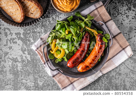 Grilled spicy sausages Grilled spicy sausages 80554358