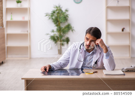 Young male doctor radiologist working in the clinic 80554509