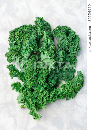 Fresh curly kale leaves on gray background, vertical, top view 80554929