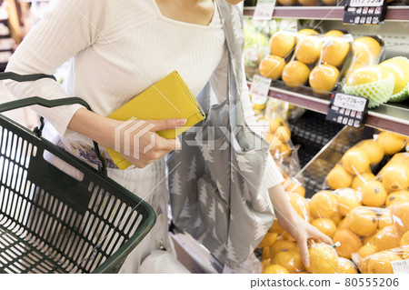 Shopping image of a young woman shopping at a supermarket 80555206