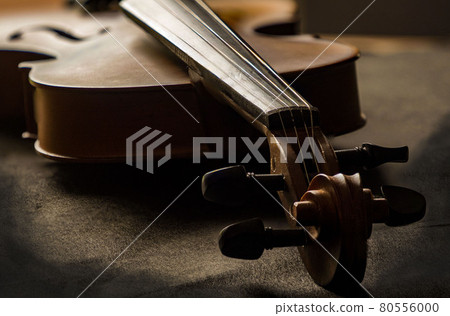 Violin in vintage style on wood background. Violin in vintage style on wood background. 80556000
