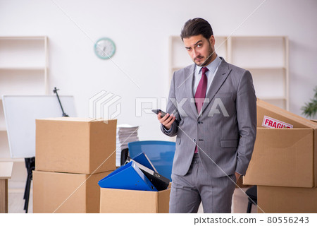 Young male employee in relocation concept Young male employee in relocation concept 80556243