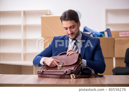 Young male employee in relocation concept Young male employee in relocation concept 80556276