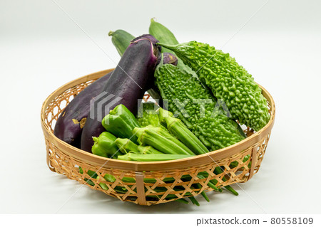 Assorted summer vegetables in a basket Assorted summer vegetables in a basket 80558109