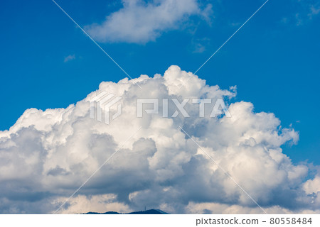 Beautiful Cumulus Clouds on Clear Blue Sky - Italian Alps 80558484