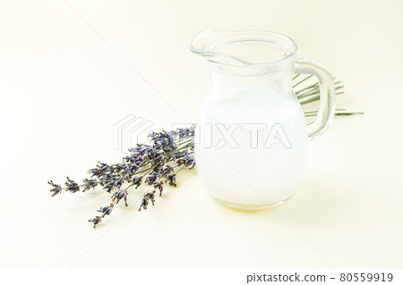 Yogurt or sour milk in jug with lavender flowers 80559919