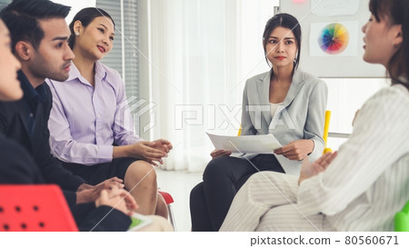 Business people proficiently discuss work project while sitting in circle Business people proficiently discuss work project while sitting in circle 80560671