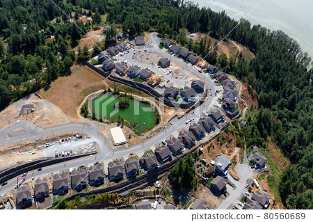 Aerial View of Residential Homes and Construction Site on a hill 80560689