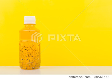 Detox drink or juice with chia seeds on white table against yellow background with copy space Detox drink or juice with chia seeds on white table against yellow background with copy space 80561358