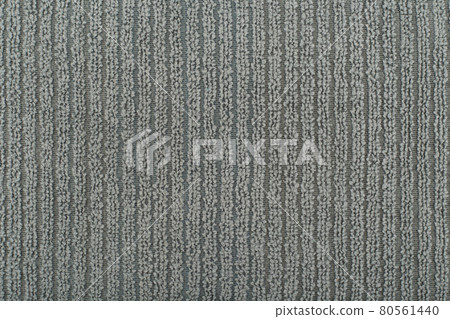 Grey flossy towel texture close up. Fluffy fabric with vertical stripes. Grey flossy towel texture close up. Fluffy fabric with vertical stripes. 80561440