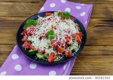 Traditional Bulgarian Shopska salad on wooden table Traditional Bulgarian Shopska salad on wooden table 80561501