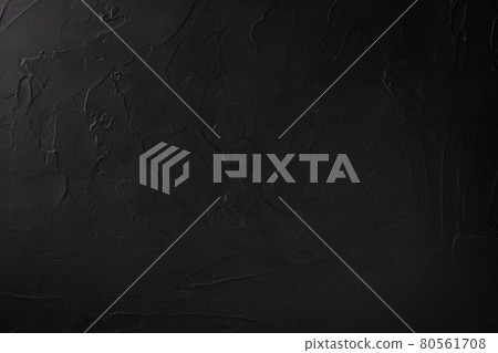 Closeup of surface with decorative black textured plaster 80561708