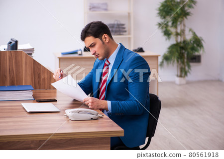 Young businessman employee working in the office Young businessman employee working in the office 80561918