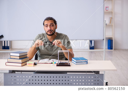 Young male student preparing for exams in the classroom 80562150