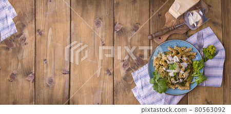 Cime di rapa pasta in a plate on with parmesan on a wooden table. Traditional food of the south of Cime di rapa pasta in a plate on with parmesan on a wooden table. Traditional food of the south of 80563092