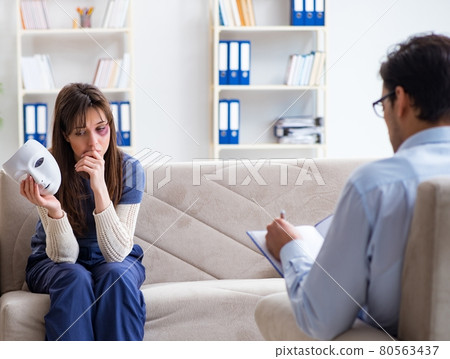 Woman suffering from home violence visiting doctor Woman suffering from home violence visiting doctor 80563437