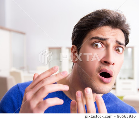 Man panicking because of pimples on the skin Man panicking because of pimples on the skin 80563930