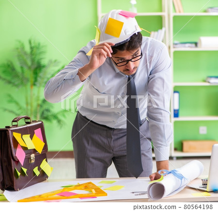 Male engineer working on new project with many conflicting prior Male engineer working on new project with many conflicting prior 80564198