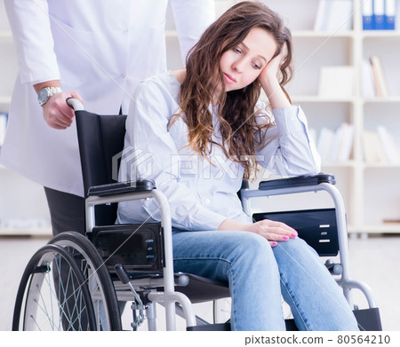 Disabled patient on wheelchair visiting doctor for regular check Disabled patient on wheelchair visiting doctor for regular check 80564210