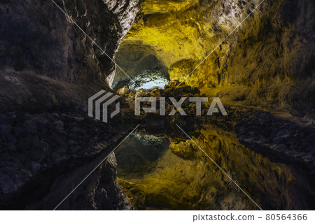 Underground lake in volcanic cave 80564366