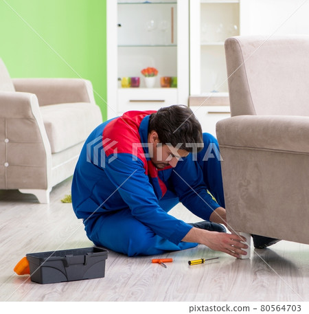 Repair contractor repairing broken furniture at home 80564703
