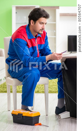 Repair contractor repairing broken furniture at home 80564707