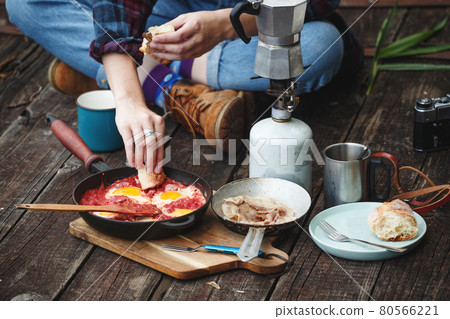 girl preparing breakfast on the pier girl preparing breakfast on the pier 80566221