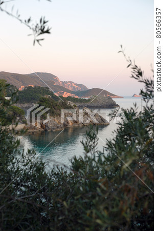 view of the cliffs of the Paleokastritsa bay in the sunset light view of the cliffs of the Paleokastritsa bay in the sunset light 80566357