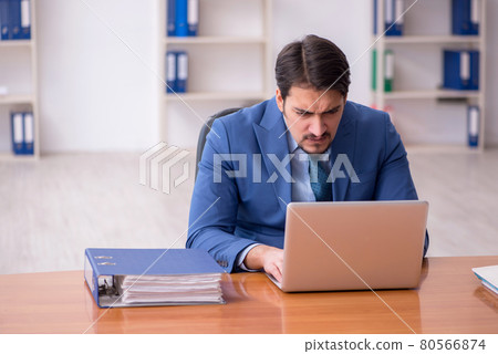 Young businessman employee working in the office Young businessman employee working in the office 80566874