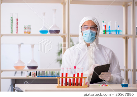 Young male chemist in drugs syntesis concept Young male chemist in drugs syntesis concept 80567890