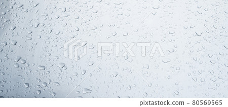 Rain drops and dew. water drops on a gray car roof after stopped raining , selective focus waterproof surface. soft focus. Leave space for writing text background. Rain drops and dew. water drops on a gray car roof after stopped raining , selective focus waterproof surface. soft focus. Leave space for writing text background. 80569565