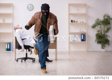 Masked man burglar stealing vaccine from old doctor Masked man burglar stealing vaccine from old doctor 80570272