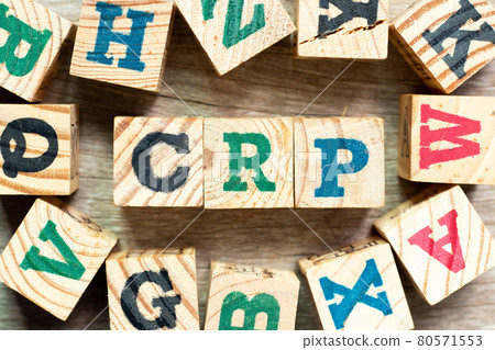 Alphabet letter block in word CRP (abbreviation of C-Reactive Protein Test) with another on wood background 80571553