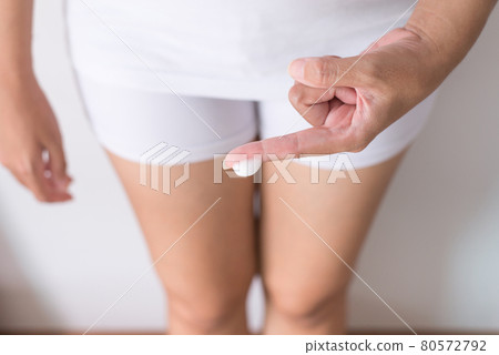 Woman with leucorrhoea and pain in abdomen or discharge with foul smell,Home remedies for leucorrhoea treatment 80572792