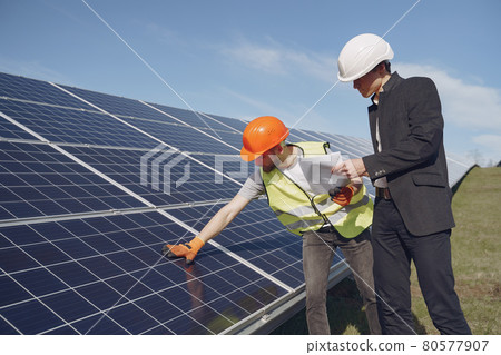 Foreman and businessman at solar energy station. Foreman and businessman at solar energy station. 80577907