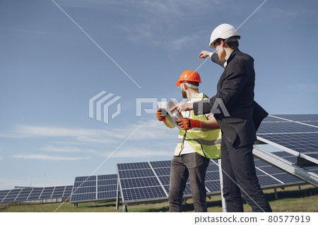 Foreman and businessman at solar energy station. Foreman and businessman at solar energy station. 80577919
