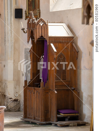 The historical confessional at neo-gothic church. 80581969