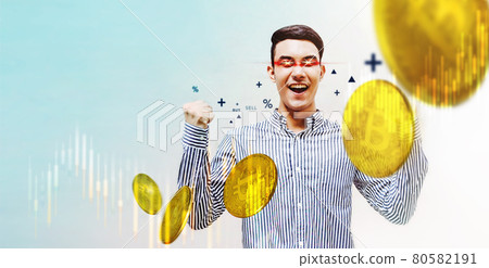 Success in Blockchain Economic Investment Concept. Young Asian Man in Cheerful posture with Laser Beam Eyes, Symbolic of Bitcoin Fans. surrounded by Bitcoins and Graph.Smart Male Earn Digital Money Success in Blockchain Economic Investment Concept. Young Asian Man in Cheerful posture with Laser Beam Eyes, Symbolic of Bitcoin Fans. surrounded by Bitcoins and Graph.Smart Male Earn Digital Money 80582191