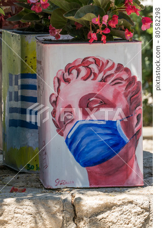 Greece, Afytos, Street Art Greek Statue with Surgical Mask 80582298