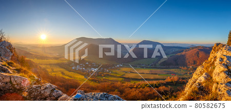 Mountainous landscape in autumn at sunset. Mountainous landscape in autumn at sunset. 80582675