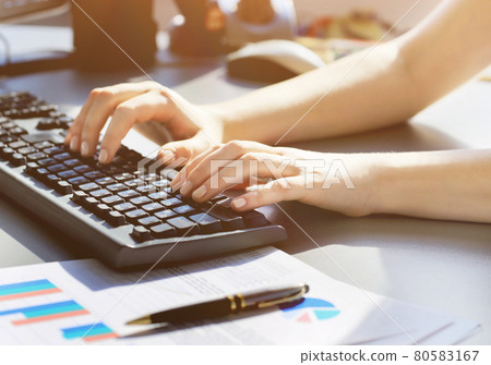 Close-up shot of a female learner typing the keyboard Close-up shot of a female learner typing the keyboard 80583167