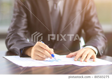 businessman works with marketing reports in the workplace 80583275