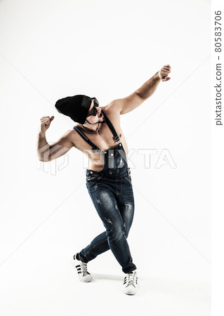 rapper with headphones and dark glasses performs a rap song rapper with headphones and dark glasses performs a rap song 80583706