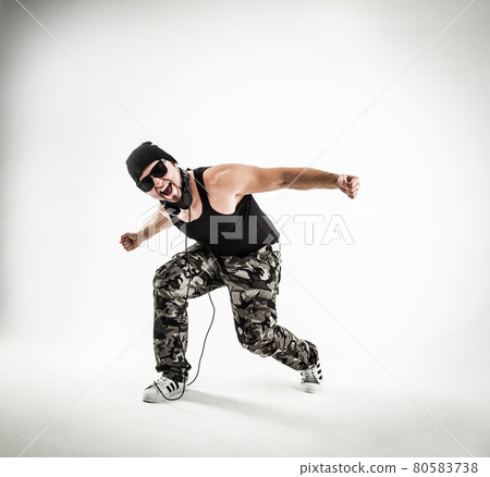 energetic and charismatic guy rapper dances break dance. energetic and charismatic guy rapper dances break dance. 80583738