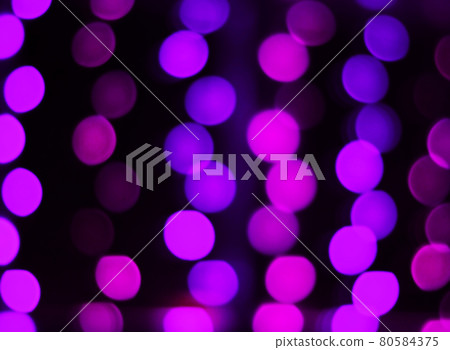 blurred image of purple lights on a black background blurred image of purple lights on a black background 80584375