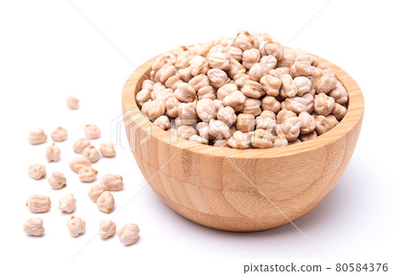 Uncooked chickpea in wooden bowl isolated on white background. healthy food Uncooked chickpea in wooden bowl isolated on white background. healthy food 80584376