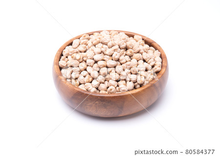 Uncooked chickpea in wooden bowl isolated on white background. healthy food Uncooked chickpea in wooden bowl isolated on white background. healthy food 80584377