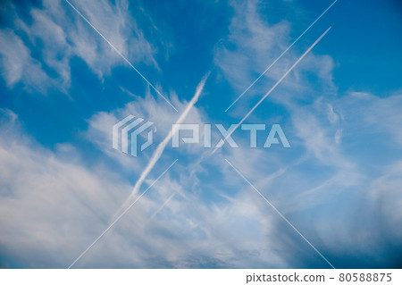 Sky with clouds moon and plane trails Sky with clouds moon and plane trails 80588875