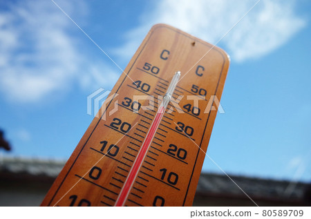 36 degree thermometer and midsummer blue sky and clouds 36 degree thermometer and midsummer blue sky and clouds 80589709